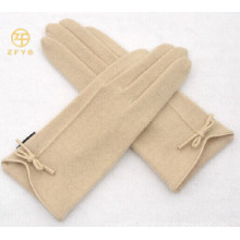 ladies wrist length wearing white wool glove